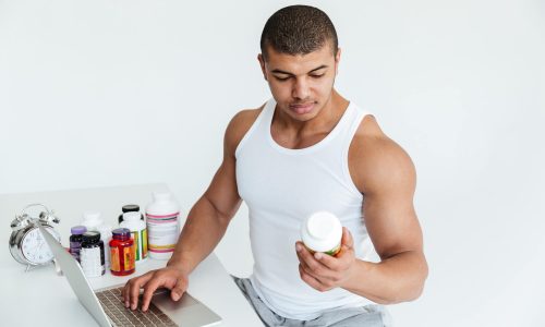 Young man holding a pre workout