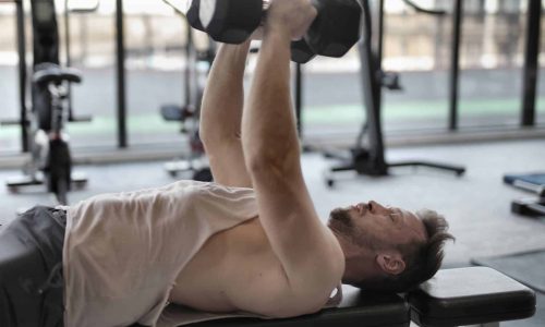 man doing floor press exercise